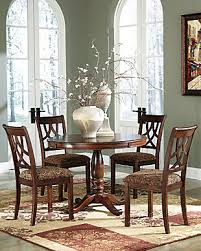 Coated in a warm finish, the hazelteen dining set proves to be small in scale, yet big on style. Hazelteen Dining Table And Chairs Set Of 5 Ashley Furniture Homestore