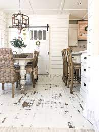 Painted hardwood floors without sanding! How To Paint And Distress Your Floors White We Painted Our Floors To Look Like An Old Farmhouse It Turned Rustic Wood Floors Rustic Flooring Diy Wood Floors