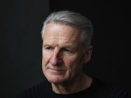 Business owner 'stunned' after seeing man lying