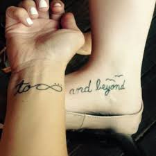 Infinity & beyond tattoo on finger. Matching Tattoo Saying To Infinity And Beyond On