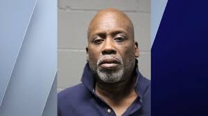 Man, 61, charged with beating, robbing woman