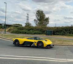 Image result for Sunburst Yellow 2017 Aston Martin