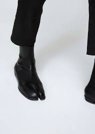 Maison martin margiela pull on biker style boots come in black leather with a rounded square toe, thick chunky heeled sole, and internal half zip. Maison Margiela Tabi Boots Tabi Shoes Boots Fashion