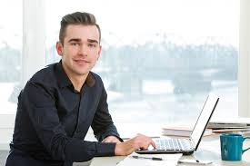 Free Stock Photo of Young man at a desk ...
