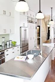 Highlight Your Modern Kitchen With Stainless Steel Modern White Kitchen Cabinets Modern Kitchen Cabinet Design White Modern Kitchen