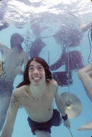 Spencer elden was the baby on the front of the 1991 nirvana album nevermind and to mark the anniversary he's made the iconic picture again. Dave Grohl Takes A Dive At Nirvana S Nevermind Pool Party 25 Years Ago Nirvana Nevermind Nirvana Kurt Cobain Dave Grohl