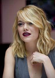 How To Style Side Swept Bangs Like 30 Of The Chicest Celebrities Bangs For Round Face Emma Stone Hair Long Hair With Bangs