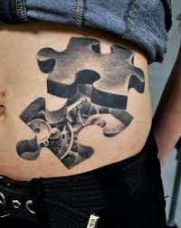 Autism Puzzle Piece Tattoo Black And White 15 Brilliant Puzzle Tattoos Puzzle Tattoos Autism Tattoos Jigsaw Tattoo