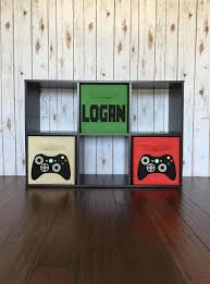 Great Idea For Setting Up A Gaming Station In A Bedroom The Tv And Console Can Sit On Top And The Bins Hold A Video Game Bedroom Video Game Decor Gamer