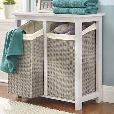 The double hamper features a lid keeping dirty clothes out of sight while also concealing any smells. Utility Laundry This Cottage Style Hamper Not Only Separates Your Lights And Darks It Mak Hamper Storage Laundry Room Storage Laundry Room Storage Shelves