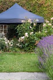 This freestanding covered patio with an outdoor kitchen and fireplace is the perfect retreat! How To Buy The Best Gazebo For Your Garden The Middle Sized Garden Gardening Blog
