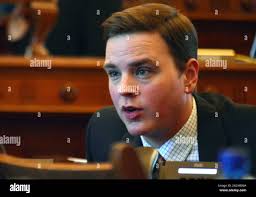Kansas state Sen. Michael O'Donnell, a Wichita Republican, speaks to a  colleague during the Senate's session, Tuesday, March 24, 2015, at the  Statehouse in Topeka, Kan. O'Donnell was among senators opposed to