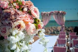 For a beach wedding, flowers that evoke an exotic/tropical feel and which can withstand heat, sun, and wind are your best bets. Summer Wedding Flower Colors The Perfect Nautical Combination