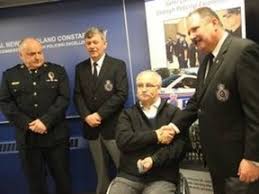 Police officers help one of their own