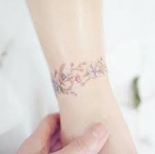 Designed with gorgeous fine lines and soft hues, these floral bracelet tattoos are. Flower Bracelet Tattoo Flower Wrist Tattoos Dainty Tattoos Pretty Tattoos