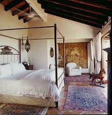 The sweeping stairway is a work of art and adds beauty to this open and welcoming space. Stylish Spanish Style Bedroom Spanish Style Decor Spanish Style Homes