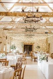Fairy Lights And Rose And Foliage Table Centrepieces In Tall Glass Vases At Caswell House Oxfor Caswell House Wedding Cotswolds Wedding Venue Cotswolds Wedding