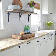 Start by painting the inside edges and openings of the face frames, then the outer cabinet sides, and finally the face frame fronts. Choosing The Best White Paint Color For Your Kitchen Cabinets