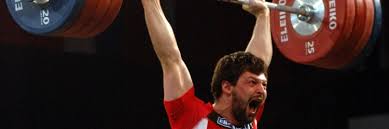 Szymon kolecki has won medals in two olympic games, taking the silver aged 19 in sydney 2000 and the gold 8 years later in beijing after being bumped up from silver due to ilya ilyin's retroactive ban. Szymon Kolecki Olimpijscy Herosi Sztangi Polski Zwiazek Podnoszenia Ciezarow