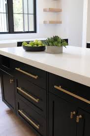 It's also an easy trend to try on a small brass hardware is an easy upgrade that will instantly make your black kitchen cabinets feel elevated. Our New Modern Kitchen The Big Reveal The House Of Silver Lining Kitchen Inspirations Kitchen Interior Kitchen