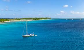 White sandy beaches lined with coconut trees, a lagoon with innumerable shades of blue, and the famous silhouette of mount otemanu in the background: French Polynesia Best Yacht Charter Sailing Holidays 2021 Sailogy