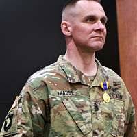 Army Sgt. 1st Class Troy Pringle (left) is congratulated