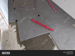 Installing ceramic tile on concrete floor video. Ceramic Tiles Tools Image Photo Free Trial Bigstock