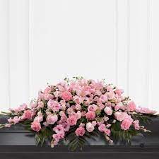 Flag etiquette and regulations do not set flowers on or above the flag at a military funeral service. Mixed Casket Spray Pink Floral Request Rothienorman Inverurie Casket Flowers Funeral Flower Arrangements Funeral Floral Arrangements