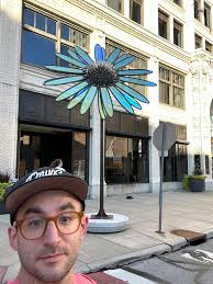 Check out our beautiful sculpture, Coneflower, blooming at the intersection  of Madison and Superior, right by Plate One!🌼 We're absolutely thrilled  with how it turned out. Shoutout to Fisher Metal Fabrication for