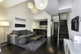 Astounding Interior Design For Small Spaces Home Apartment With Dark Gray Sofa Living Room Loft Dark Wood Floors Living Room Living Room Decor Dark Wood Floor