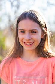 Portrait of smiling girl in the garden stock photo