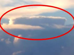 A very scary hybrid alien creature is spotted on the side of the road that looks straight into the camera. Unbelievable Ufo Sighting Behind Massive Cloud Caught On Camera Is It Proof Aliens Exist Irish Mirror Online