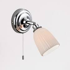 Light and shadow play along walls for decorative effects and many fixtures are dimmable to further enhance the room's mood. Sola Twin Porcelain Bathroom Wall Lights With Pull Switch Ip44 Lampsy