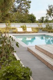 Raised Vegetable Beds Alongside A Pool And Grasses In This Sonoma Garden Designed By Terremoto Poured Concrete Patio Backyard Pool Designs Pool Landscaping