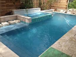 Rain Waterfall Into A Glass Tile Spa With Stepping Stones Crystal Pools And Spas Kleine Hinterhof Pools Pool Rechteckig Luxusschwimmbader