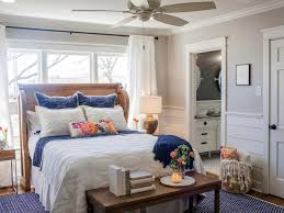 A blue bedroom is a traditional preferred color but that doesn't indicate it must be boring. Gorgeous Country Wood Headboard Royal Blue Bed Accents And Large Area Rug In Neutral Bedroom Hgtv