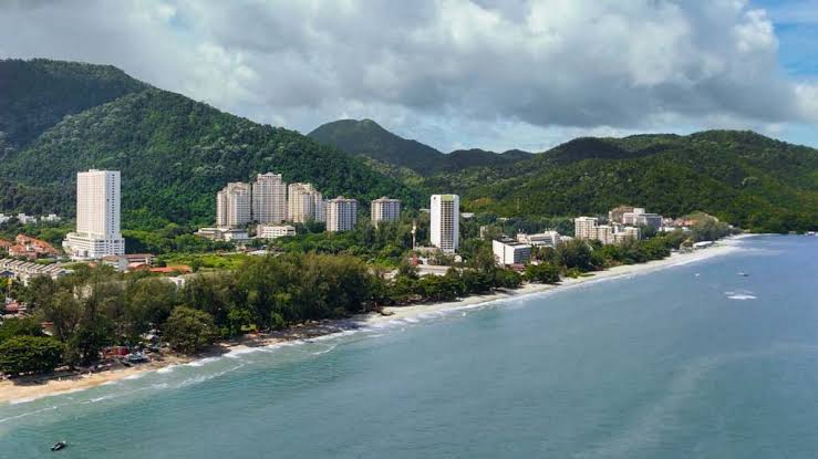 Tropical coastline and palm trees along the Penang shore