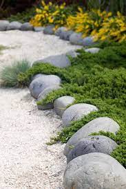 Alpine rock gardens are also very popular, consisting usually of creeping thyme, phlox, and candytuft. Secret Garden Landscaping Rock Edging And Ground Cover Conifer River Rock Garden Landscape Edging Rock Garden Landscaping