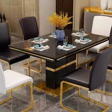 The table showcases an elegant design that begins with a rigid hardwood frame. Modern Glass Dining Table Set Black With 6 Faux Leather Chairs Gaze Furnishings