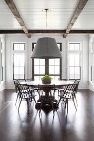 Gray Hanging Shade Light Over Round Wooden Dining Table Cottage Dining Room