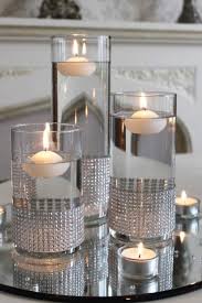 Set Of Cylinder Vases With Diamante Bands And Placed On A Mirror Plate And Silver Sequin Table Run Mirror Centerpiece Floating Candle Centerpieces Candle Decor