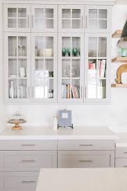 light gray kitchen cabinets with gold