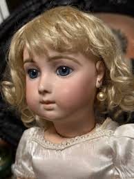 Hello everyone! I am seeking some information to help me with this exciting  doll find. I couldn't believe my eyes when I spotted this sweet doll at an  antique shop for an