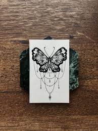 Butterfly Chandelier Temporary Tattoo Black Delicate Line Etsy In 2021 Unique Butterfly Tattoos Geometric Tattoo Design Butterfly Chandeliers