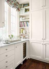 A combination of white painted cabinetry and rustic hickory cabinets create an earthy and bright kitchen. Crisp Classic White Kitchen Cabinets Southern Living