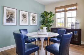 Bold Blue Leather Chairs And An Aqua Accent Wall Pairs Beautifully In This Dining Room We Complet Dining Room Blue White Dining Chairs Dining Room Inspiration