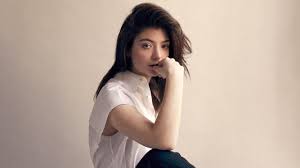 Lorde appears to be on a commune as she struts through the beach where people are seen in dance sequences, playing board games, picnicking, dancing on the water and holding the singer up on a litter. The House Of Lorde Style The Sunday Times