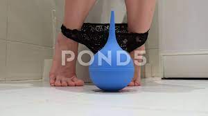 Woman sits on a toilet with lowered pant... | Stock Video | Pond5