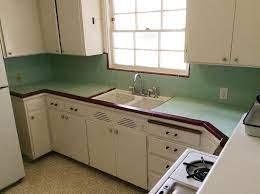 Next, you can build up a modern look by combining antique white kitchen cabinets with black appliances. Create A 1940s Style Kitchen Pam S Design Tips Formula 1