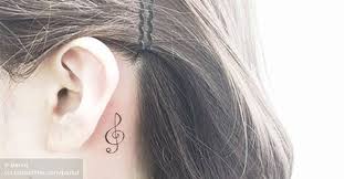 In this case, the treble clef is combined with a microphone. G Clef Tattoo Behind The Left Ear